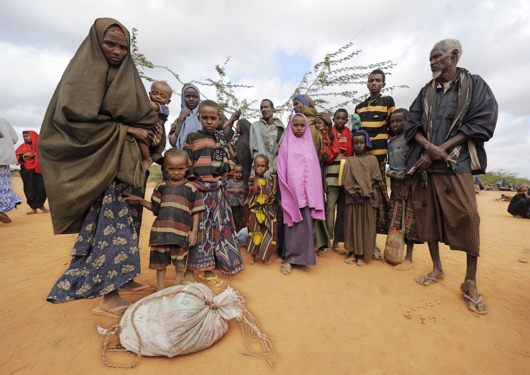 After weeks on the move these Somalian refugees have finally reached a refugee camp in Dadaab, northeastern Kenya, Wednesday, August 3, 2011. Somalia and parts of Kenya have been struck by one of the worst droughts and famines in six decades, more than 350.000 refugees have found shelter in the world's biggest refugee camp. Photo: Boris Roessler dpa  +++(c) dpa - Bildfunk+++