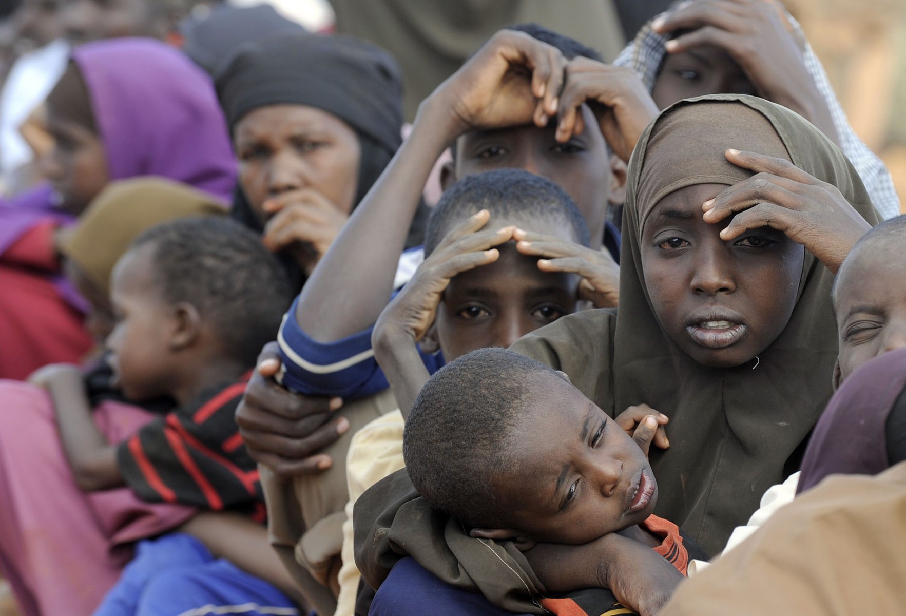 After weeks on the move Somali refugees have finally arrived at a refugee camp in Dadaab, northeastern Kenya Friday, August 5, 2011 and are now waiting to be granted access to a first medical examination and registration. Somalia and parts of Kenya have been struck by one of the worst droughts and famines in six decades, more than 350.000 refugees have found shelter in the world's biggest refugee camp. Foto: Boris Roessler dpa  +++(c) dpa - Bildfunk+++